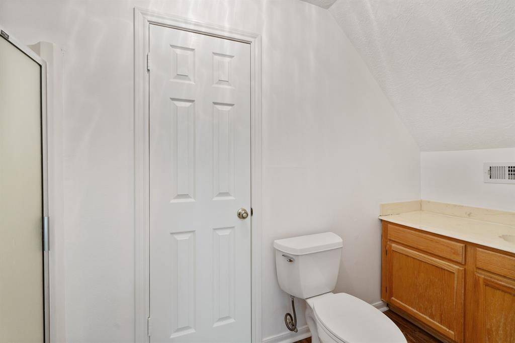 The spacious fourth bedroom features its own full bath. Perfect for guests or a private suite.