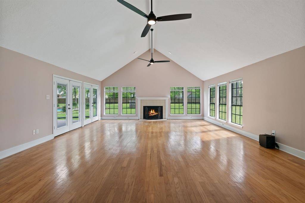 This lavishly spacious living room provides the perfect setting for family gatherings and stylish living.