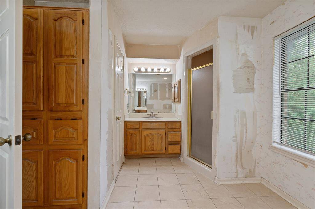 Imagine this spacious primary bathroom, completely renovated to suit your style.