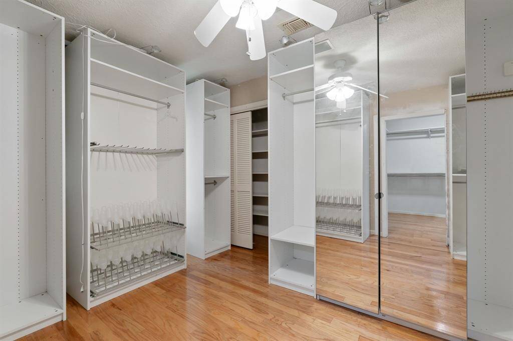 Spacious walk-in closet offers ample storage and organization, creating the perfect space for your wardrobe.