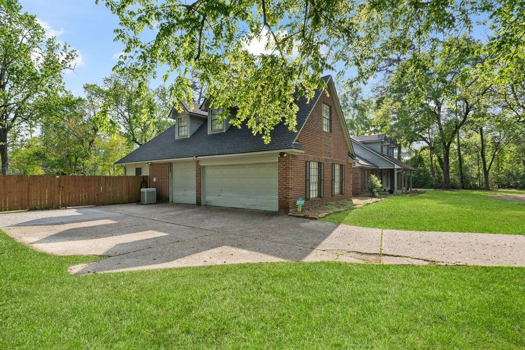 Spacious three-car garage and a large driveway for multiple vehicles