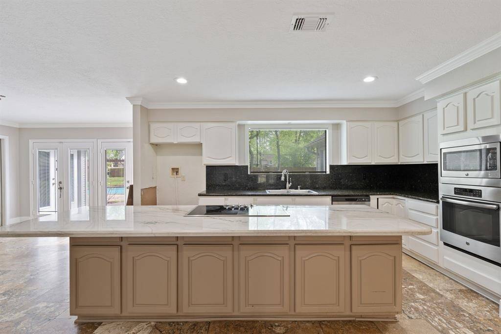 Kitchen offers an open layout with abundant lighting.