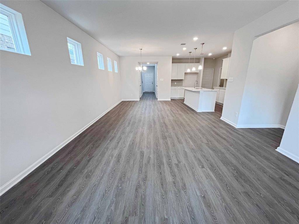 The Robin II- Family Room into Dining. Home under construction, image used for illustrative purposes only, colors and options will vary.