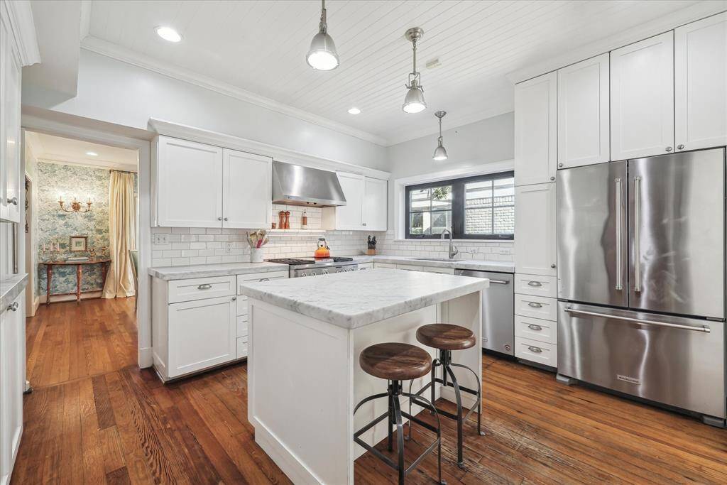 Another view of Kitchen. Door on left conveniently leads to Formal Dining room.