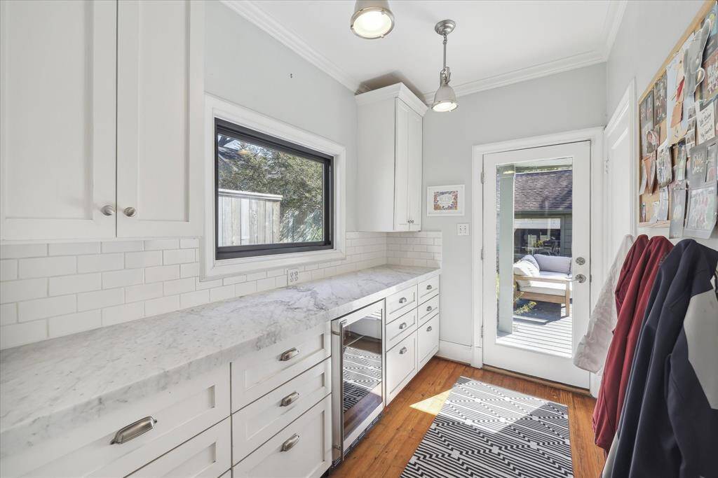 Butler's pantry/mudroom area off of Kitchen access to deck and backyard. Door on right leads to downstairs half bath.