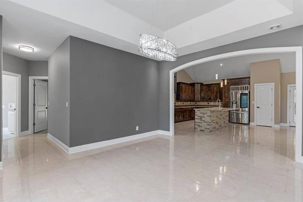 View from the formal dining into the open concept kitchen.