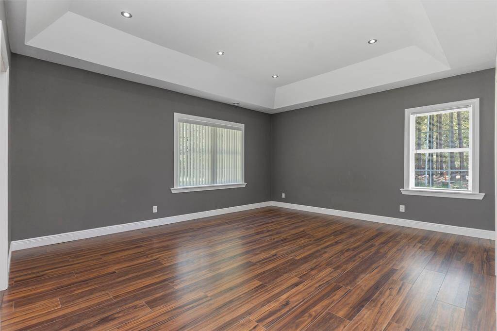 Large bedroom with vaulted ceilings.