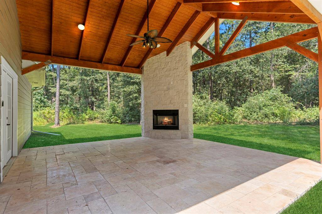 Serene, large back patio perfect for relaxing after a long day in front of the fireplace.