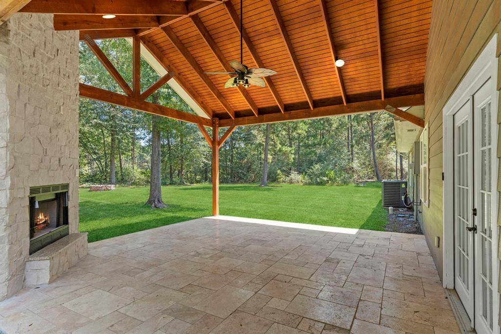 Large open covered patio off the back of the home with serene private views. Plenty of outdoor space for furniture and even a grill.