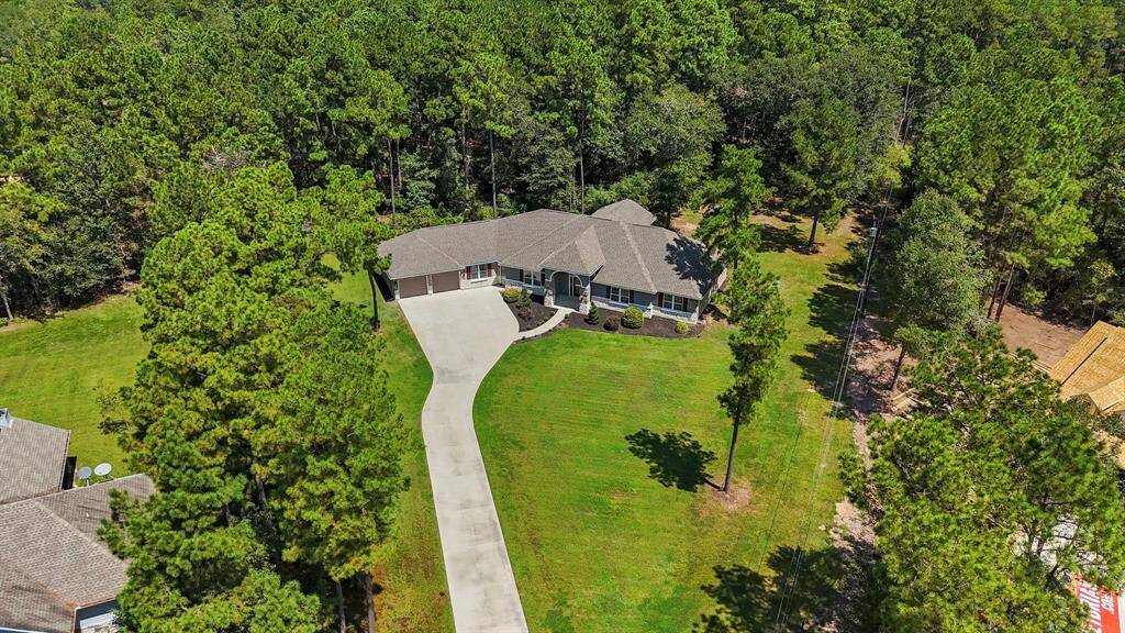 Long concrete driveway to this beautiful home.