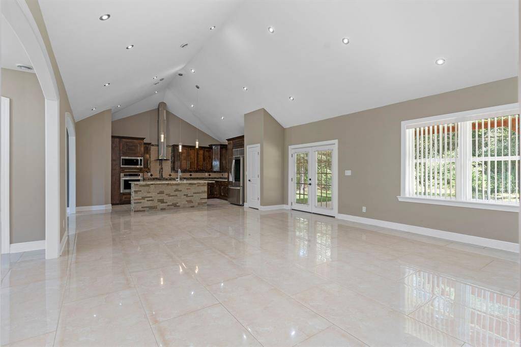 Large open space with plenty of recessed lighting and an abundance of natural light.