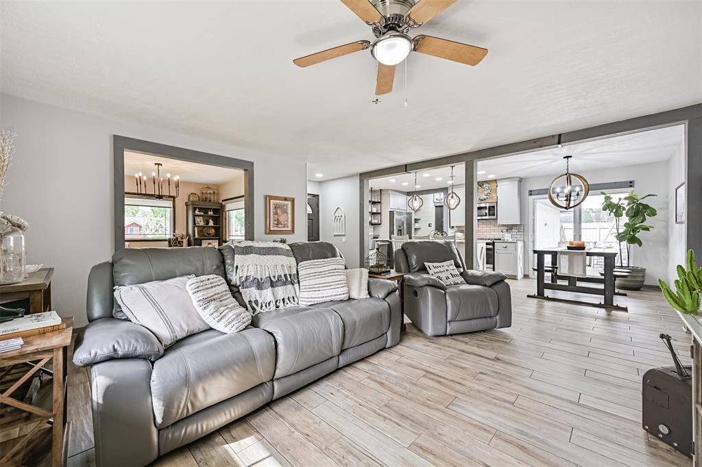 Spacious living room flows seamlessly into the fully redesigned kitchen—perfect for entertaining, gathering, and everyday living with effortless connection.