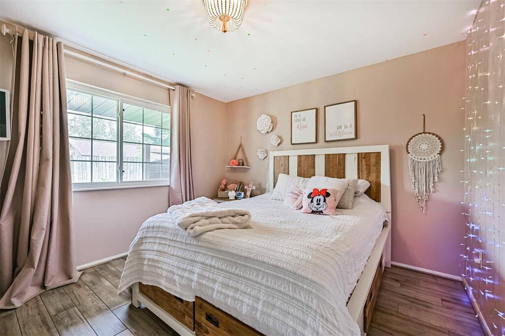 Bedroom 2 features a spacious closet with custom shelving for organized storage