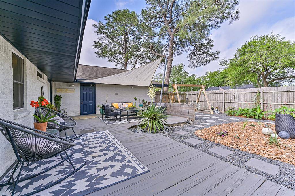 The exterior of the home has been painted, giving it a clean, modern look that complements the updated landscaping and design.