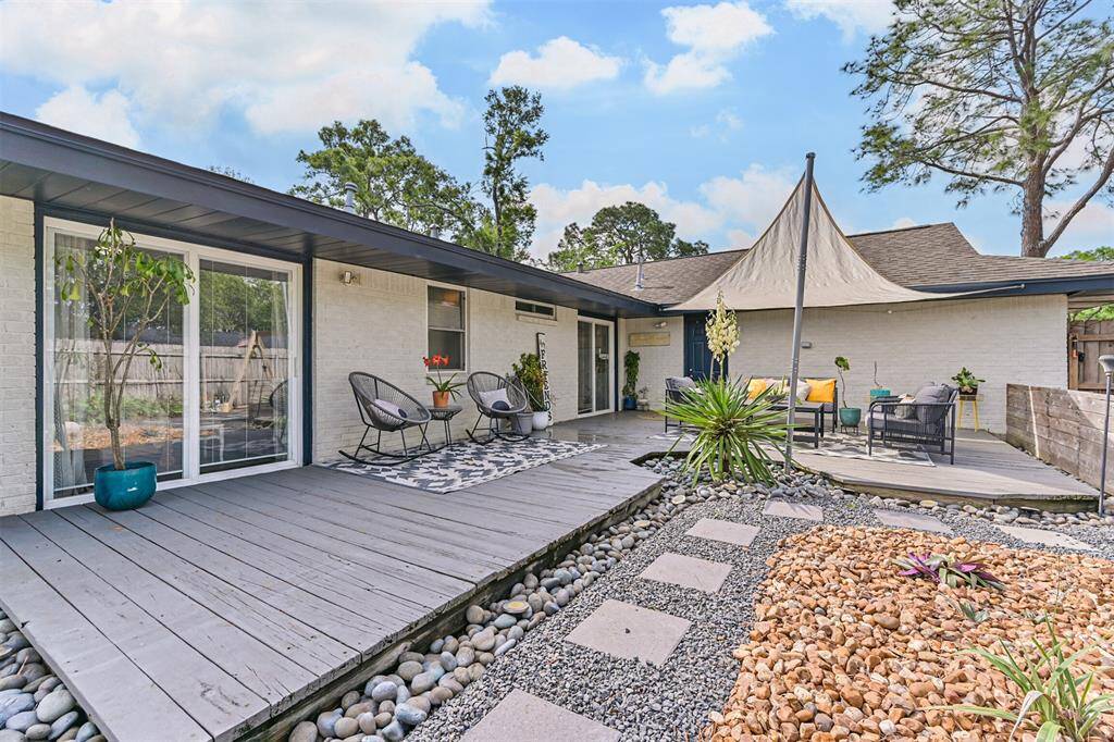 The expansive backyard deck extends directly from the primary bedroom, creating a private outdoor escape, ideal for morning coffee or evening unwinding.