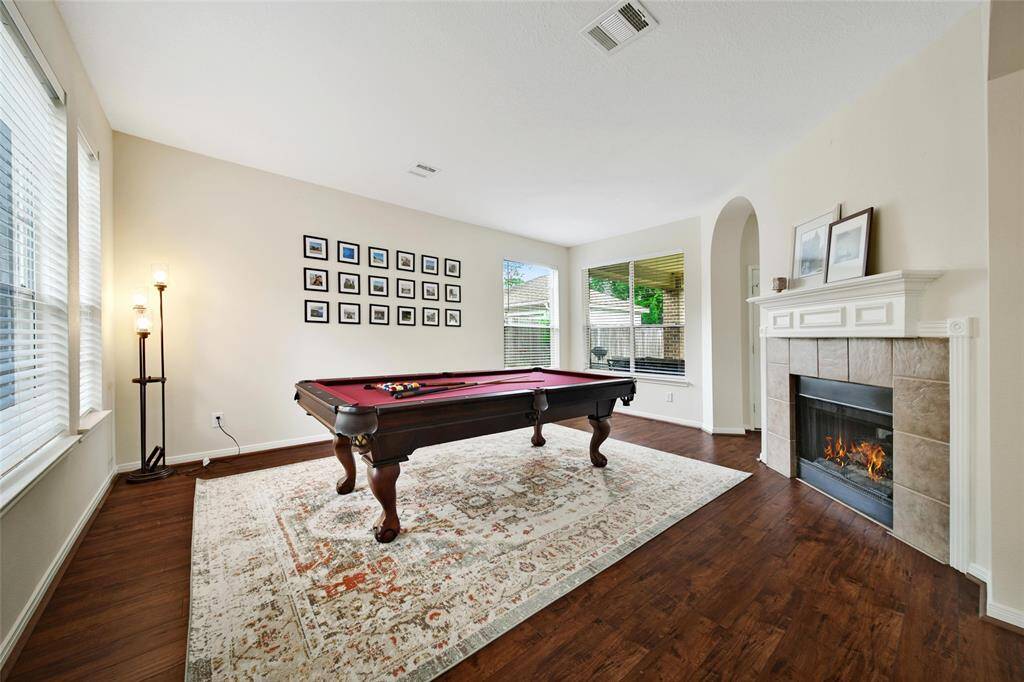 At the front of the home is another living space. This flexible room could be an office, gameroom, or extra entertaining space.