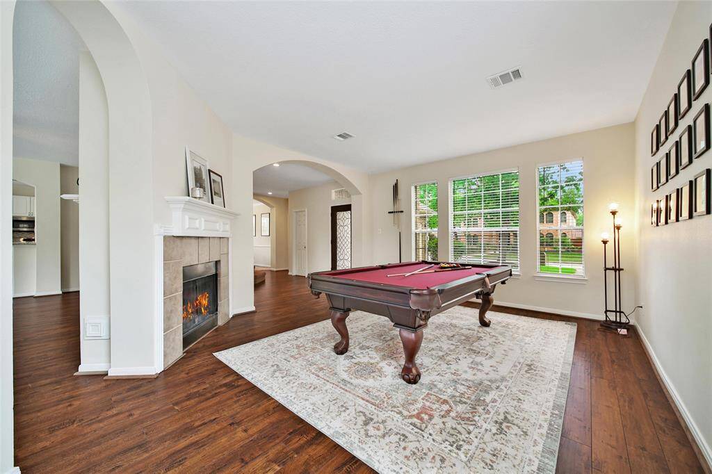 A two-sided gaslog fireplace adds a cozy atmosphere to the living room and family room.
