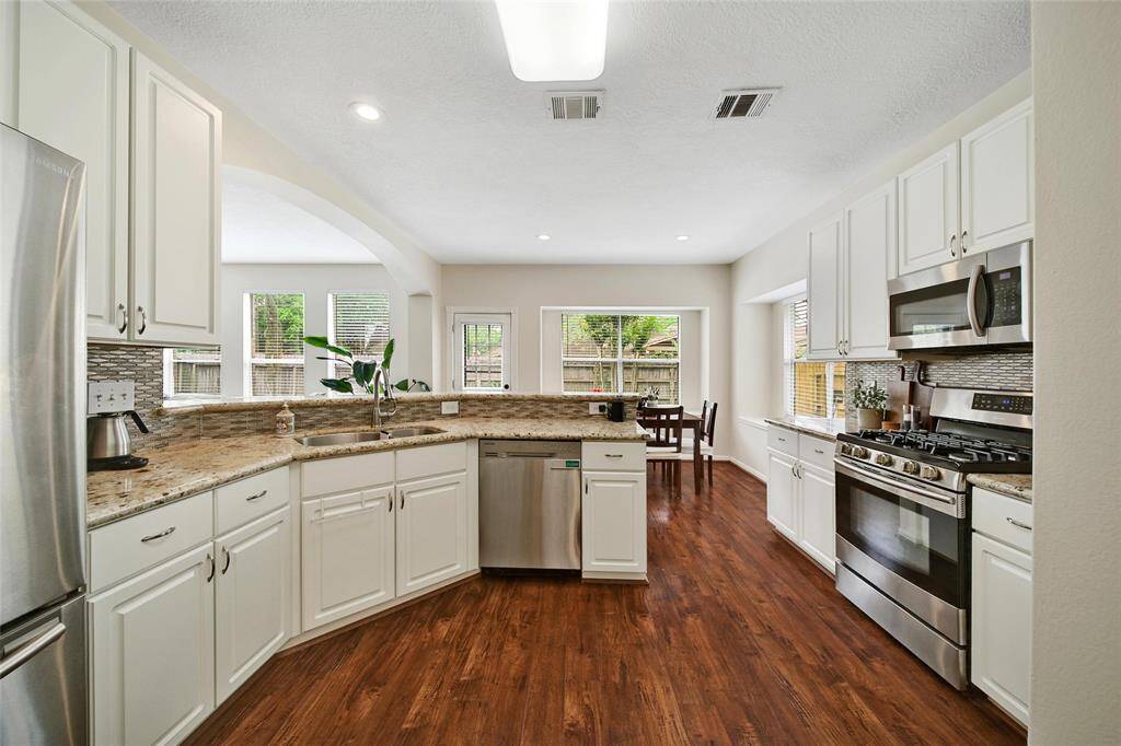 Stainless steel appliances including a gas range.