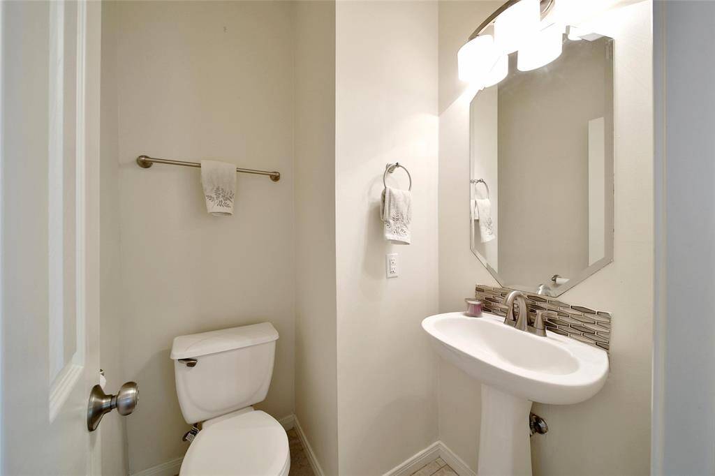 A first floor half bath is easily accessible for guests.