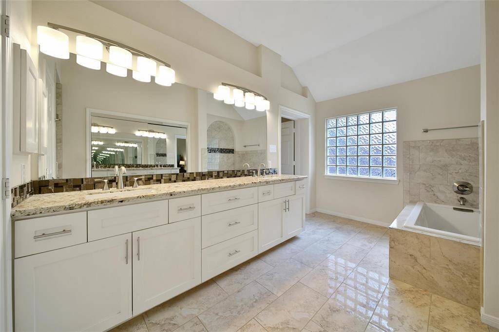 Dual sinks on an extended vanity make it easy to share.