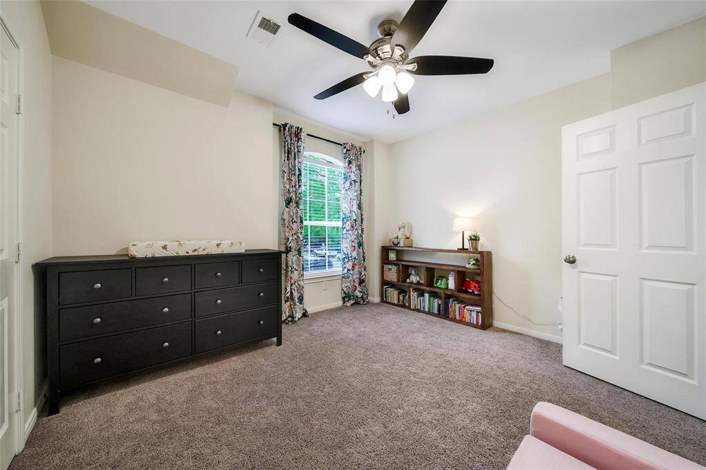 The secondary bedrooms are spacious and bright. This one next to the owner's suite makes a fantastic nursery or use this as an office.