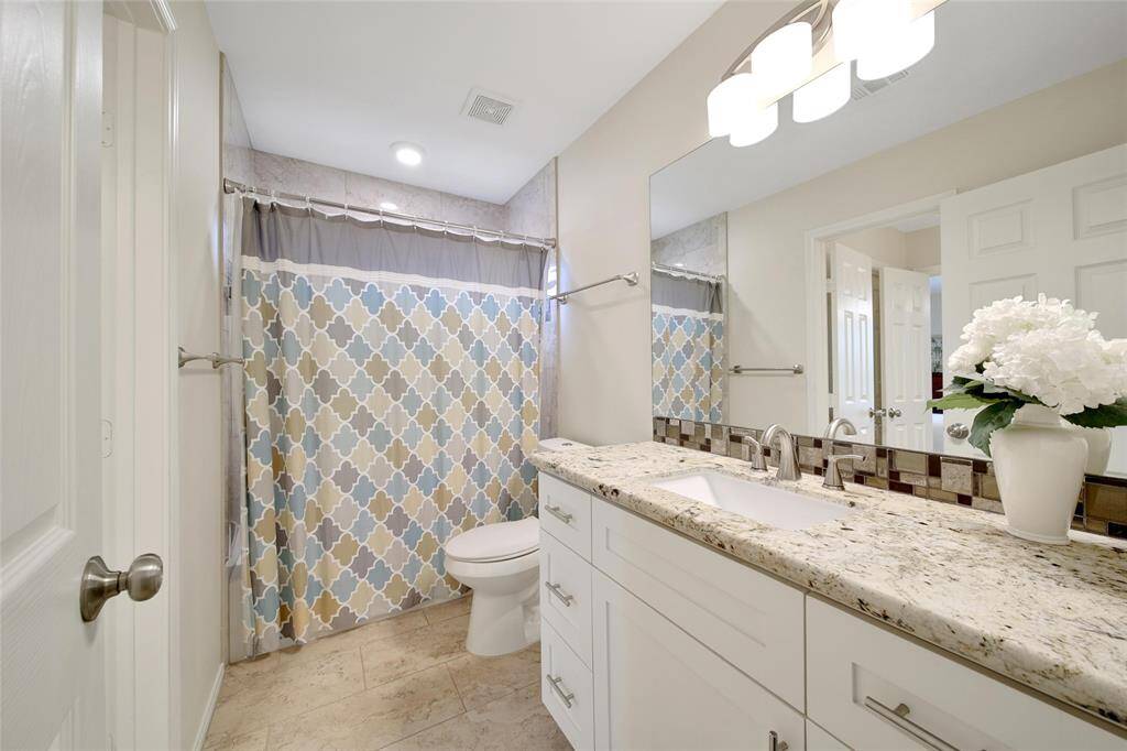 The upstairs bath boasts 2 entrances and sinks to make sharing a little easier.