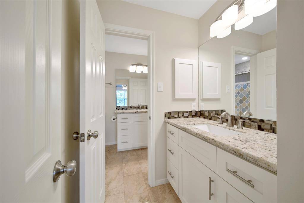 This bedroom offers private access to the secondary bath with it's own sink.