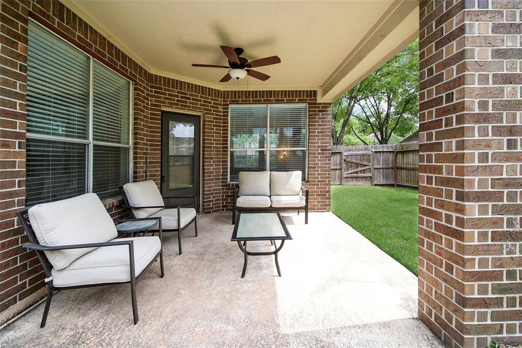 Relax under the shade of your covered patio and enjoy your new backyard.