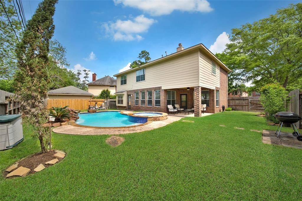 A large side yard leaves plenty of space for the kiddos and pets to play.