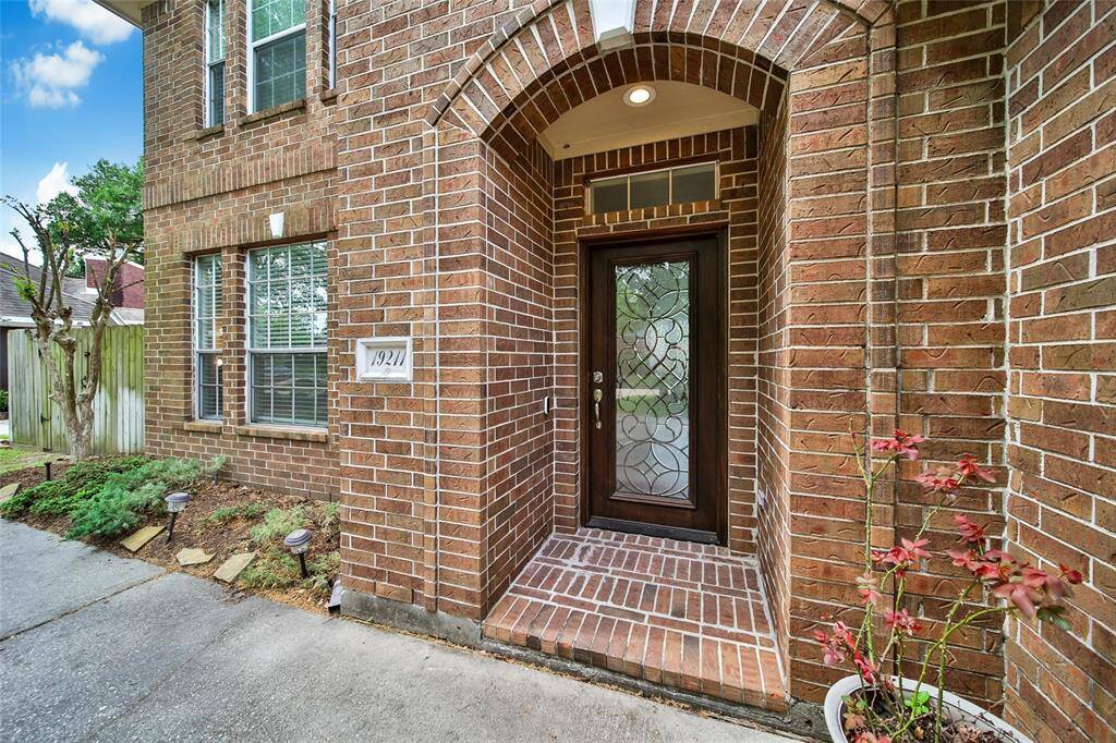 This home offers great curb appeal with a side swing garage, inviting landscaping, and elegant front door.