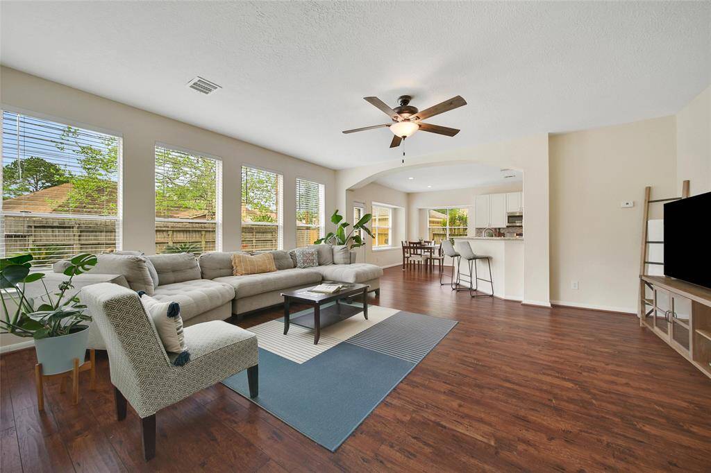 Wood flooring flows throughout the first floor living areas.