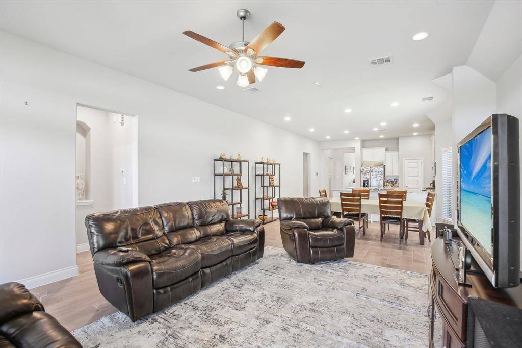 Flowing into the Open Concept, Dining, and Family Room, featuring 10-foot ceilings throughout.
