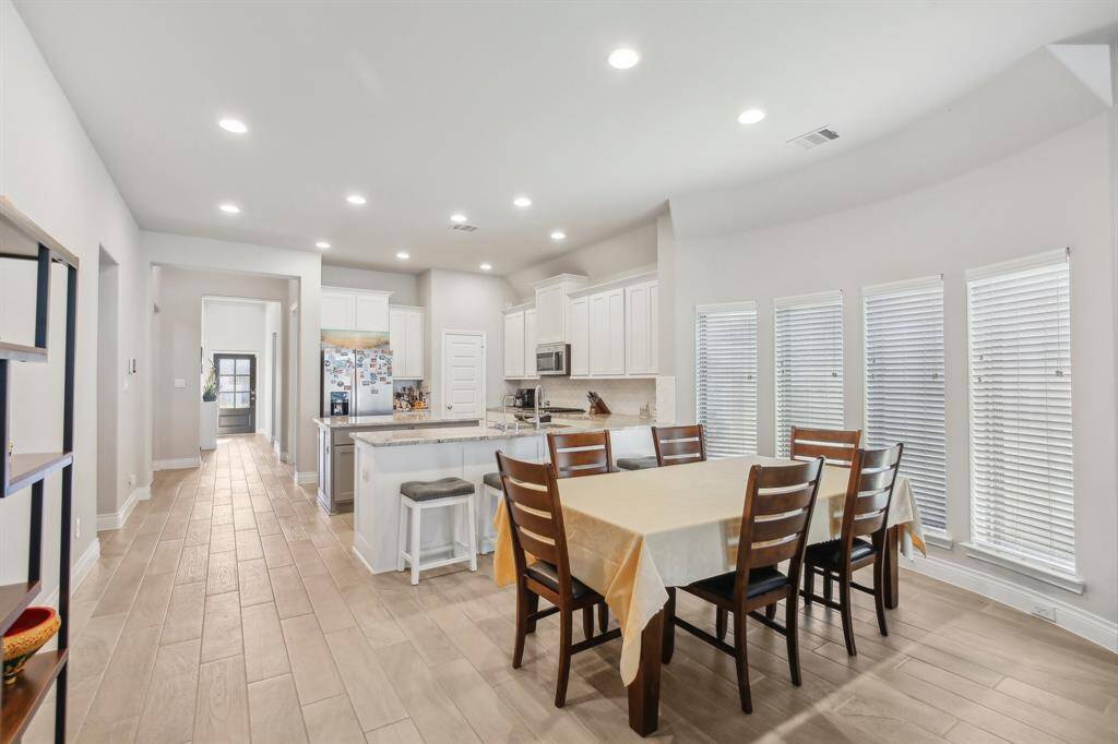 Light and bright space open tokitchen and dining area with a beautifulview out the many windows.