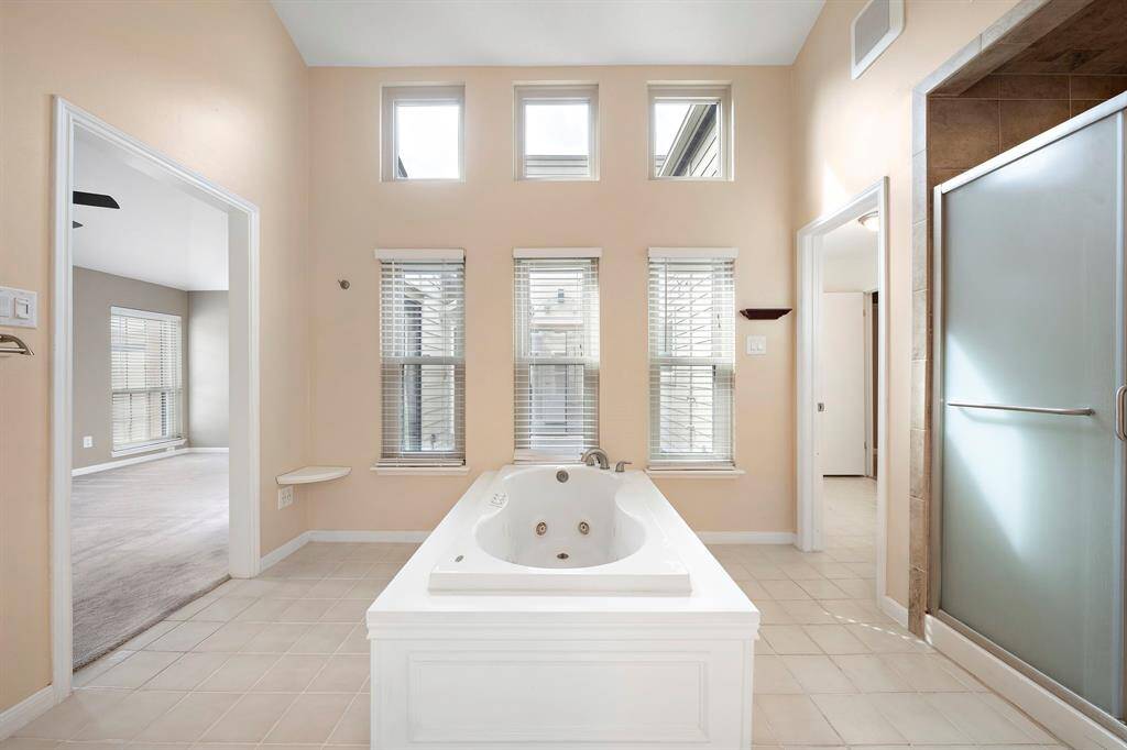 Jetted tub and a separate walk in shower