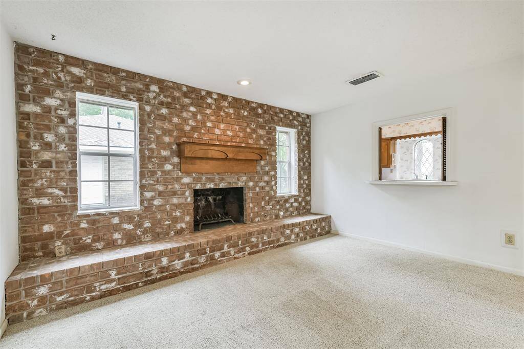 Cozy fireplace is a great focal point for large living area