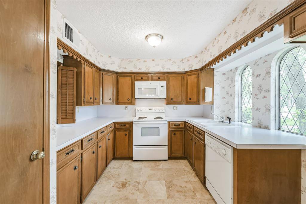 well made wooden cabinets with a great view and open to the living room space.