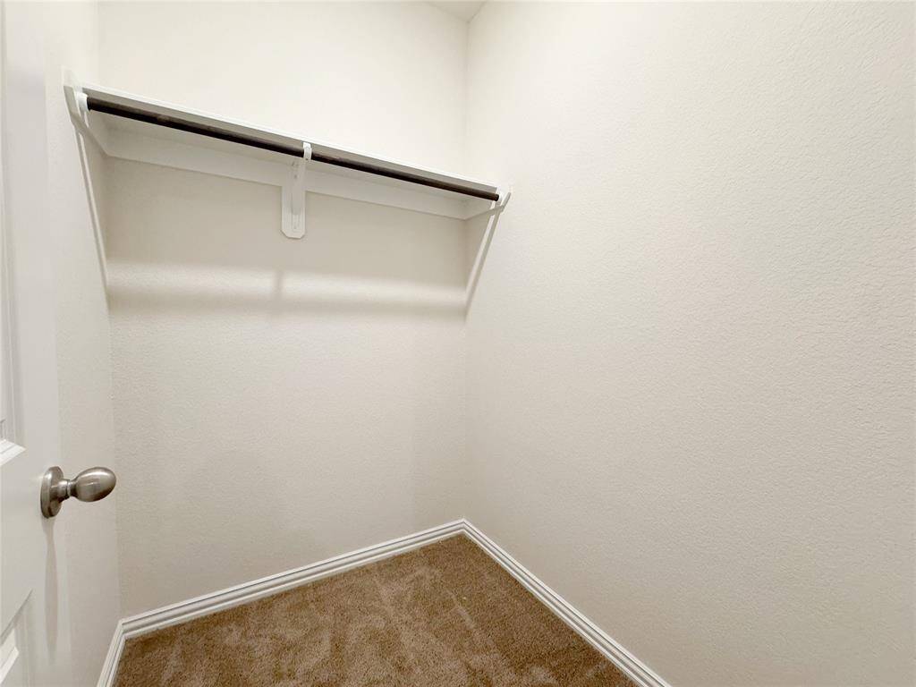 Extra closet for storage by garage door