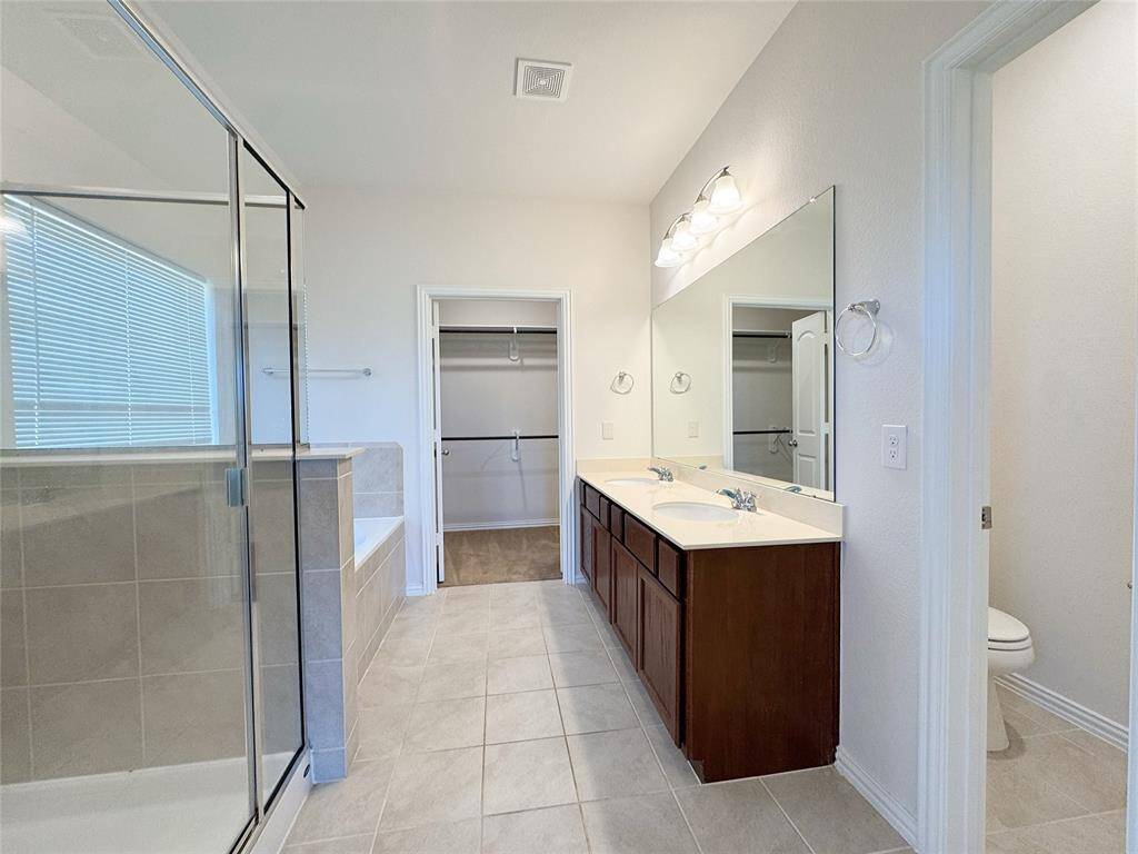 Primary bath with double vanities and separate tub and shower