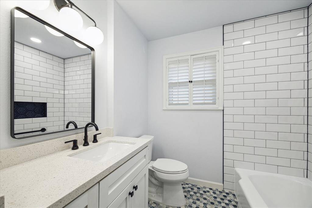 The bright an fresh secondary bathroom was renovated in 2003, complete with PEX plumbing.