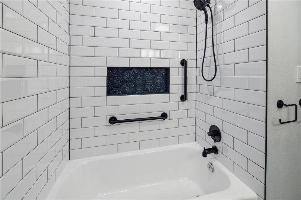 View of the bath/shower combo in the secondary bathroom.