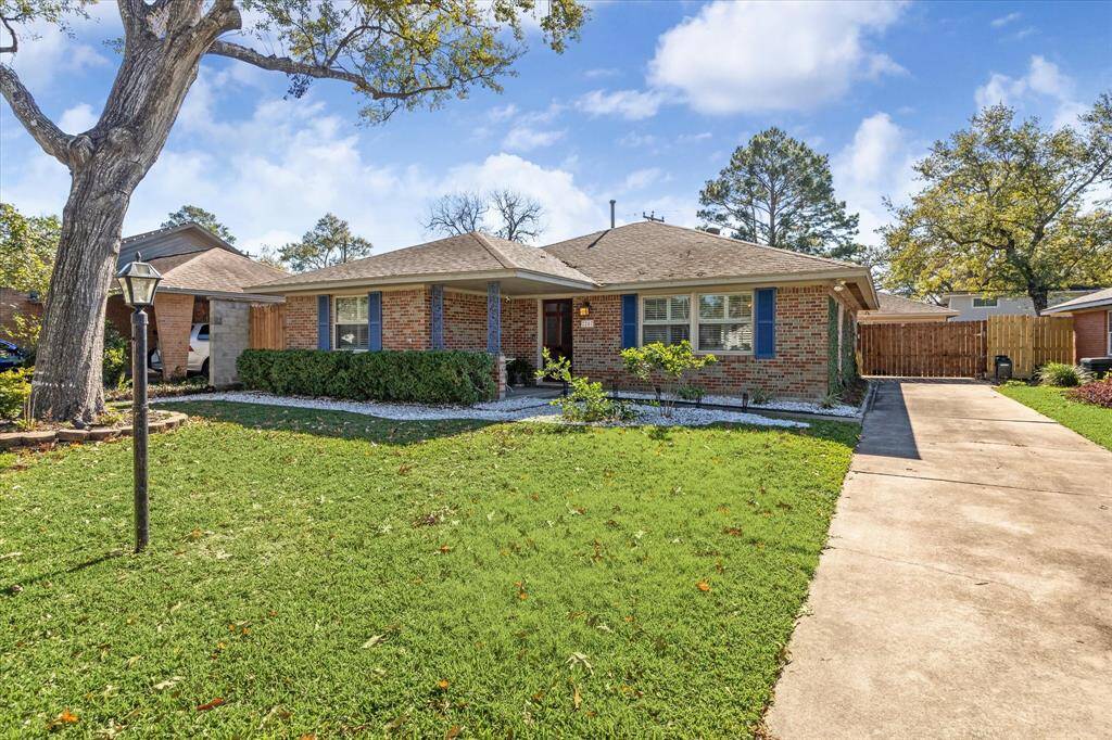 Upon arrival you'll notice this georgous brick home features a large front yard with an extended driveway for plenty of parking.
