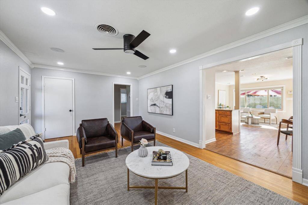 This view of the living room is from the opposite side. The large entryway to dining area and kitchen gives this room a cozy, yet open feel.