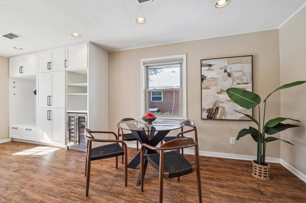 Another view of the dining area. Plenty of space here for a china cabinet or a different table shape or size.