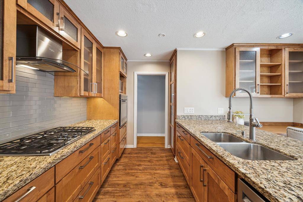 You'll enjoy every moment of this kitchen featuring soft close drawers, tons of storage, a sizable full pantry, and updated appliances. There is ample counter space here, with plenty of light.