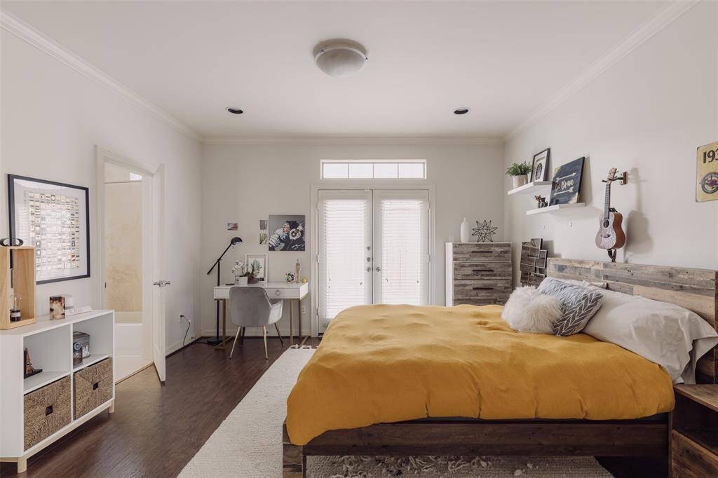 first floor bedroom with the french door leading to backyard space