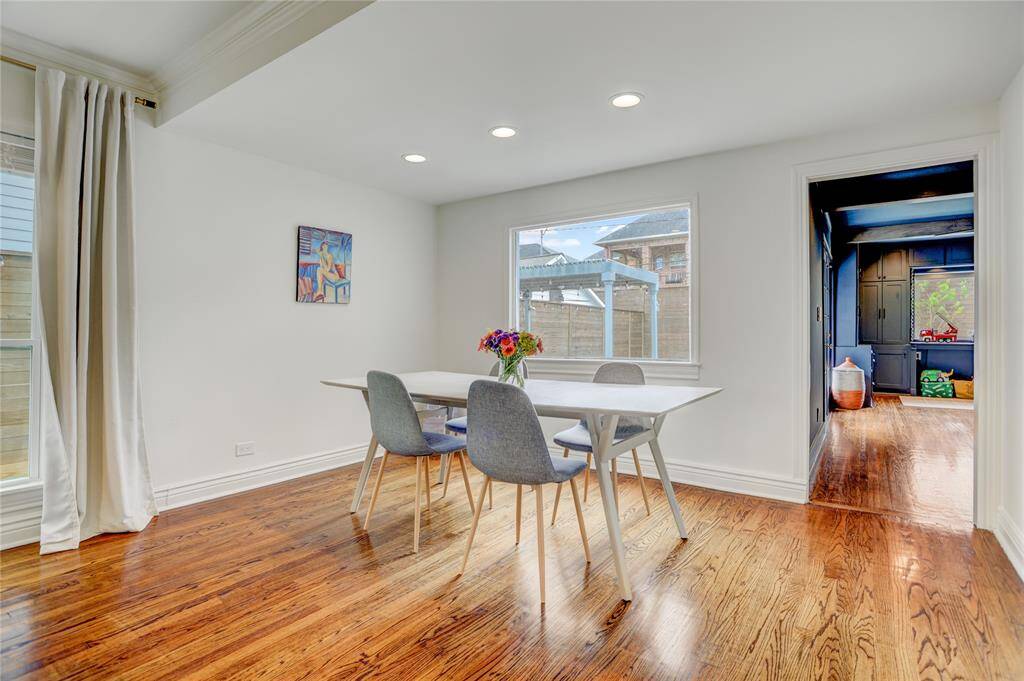 Dining area opens to family room with backyard view.
