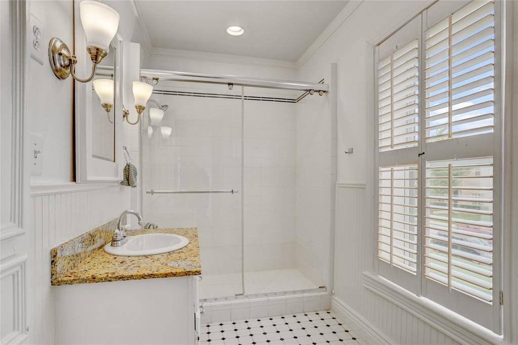Bright secondary bathroom with window.