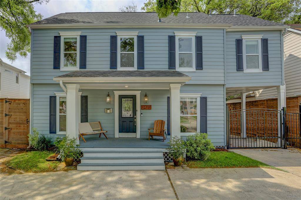 Final look at the front elevation, featuring a brand-new metal gate for easy access to the covered carport.