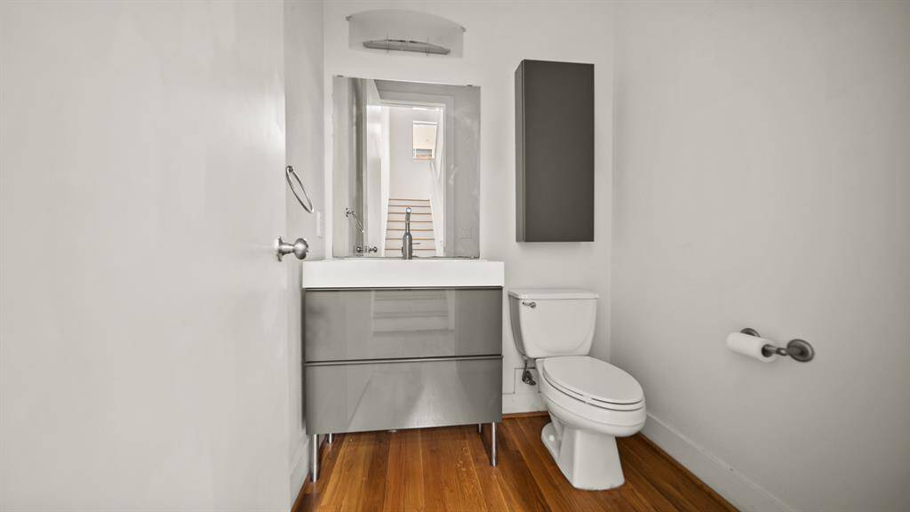 Modern powder room conveniently located on the second floor, near the living area for easy access.