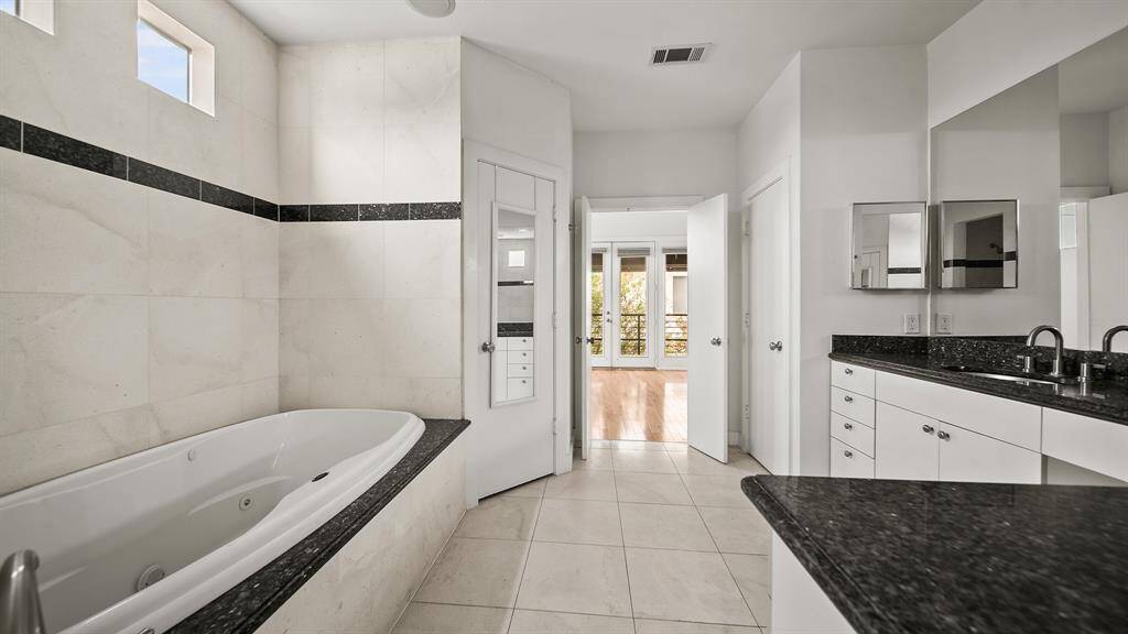 Another angle of the luxurious primary en-suite bathroom.